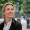Portrait of a thoughtful business woman outdoors in London smiling Portrait of a thoughtful business woman outdoors in London