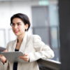 Smiling businesswoman using tablet