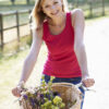 Attractive Woman Riding Bike Along Country Lane Attractive Woman Riding Bike Along Country Lane