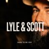 A close up cropped advertising shot of a bearded male model featuring Lyle and Scott brand text.